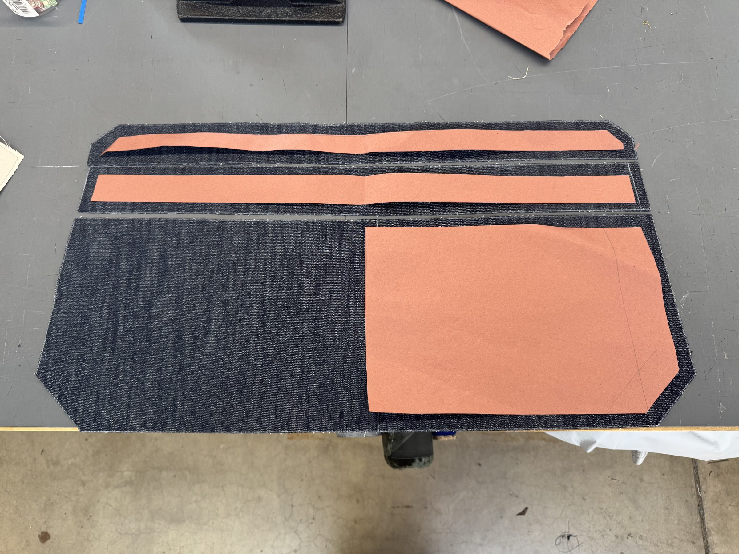 Pattern pieces laid out on denim