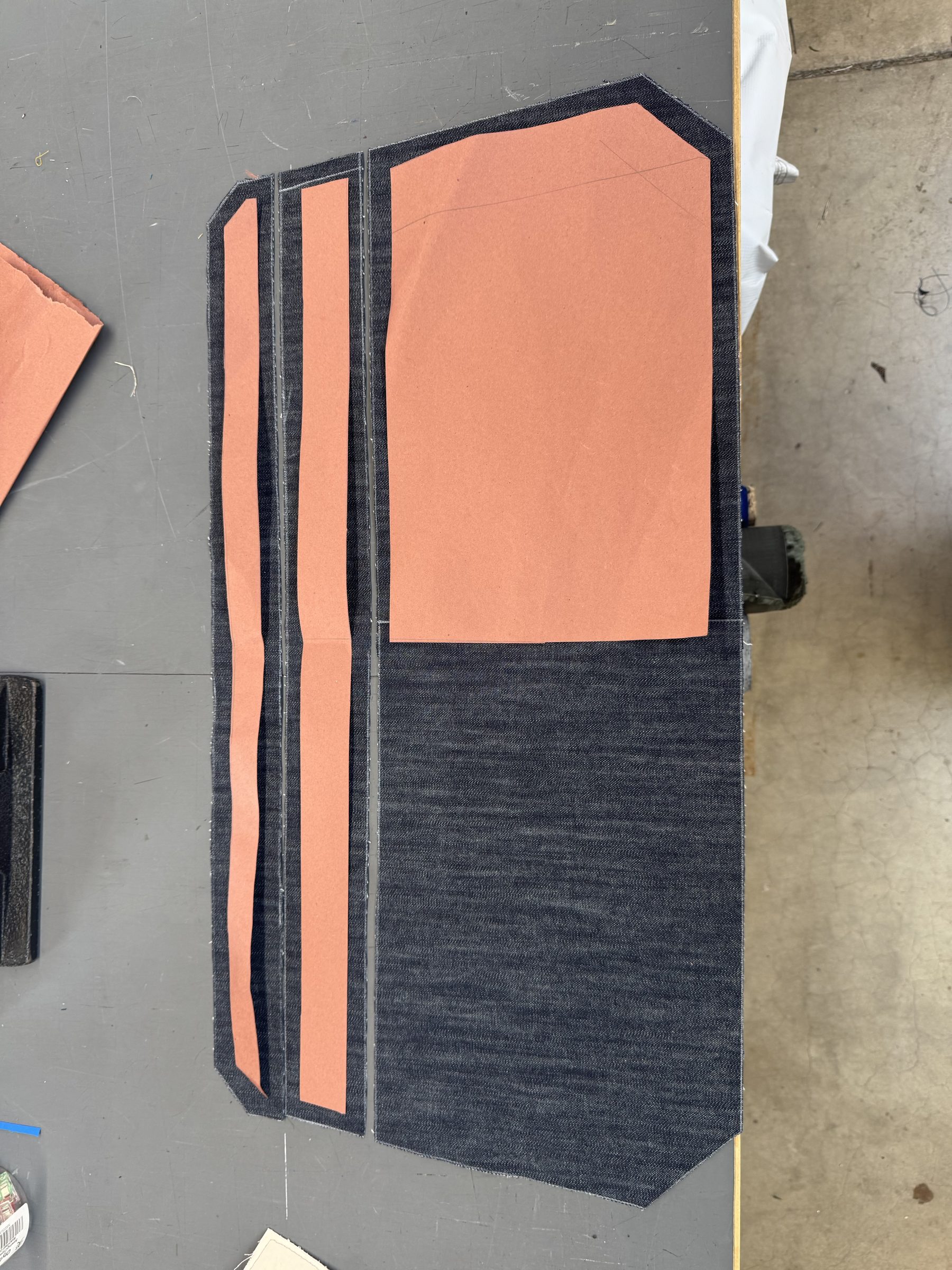 Pattern pieces laid out on denim